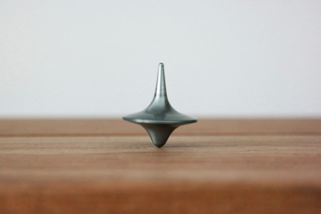 A balance spinner sitting upright on a table countertop.